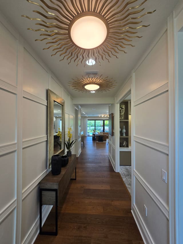 Hallway with a feature ceiling light