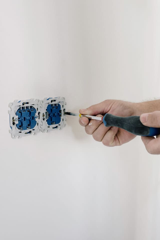 Double power points being fitted to a wall